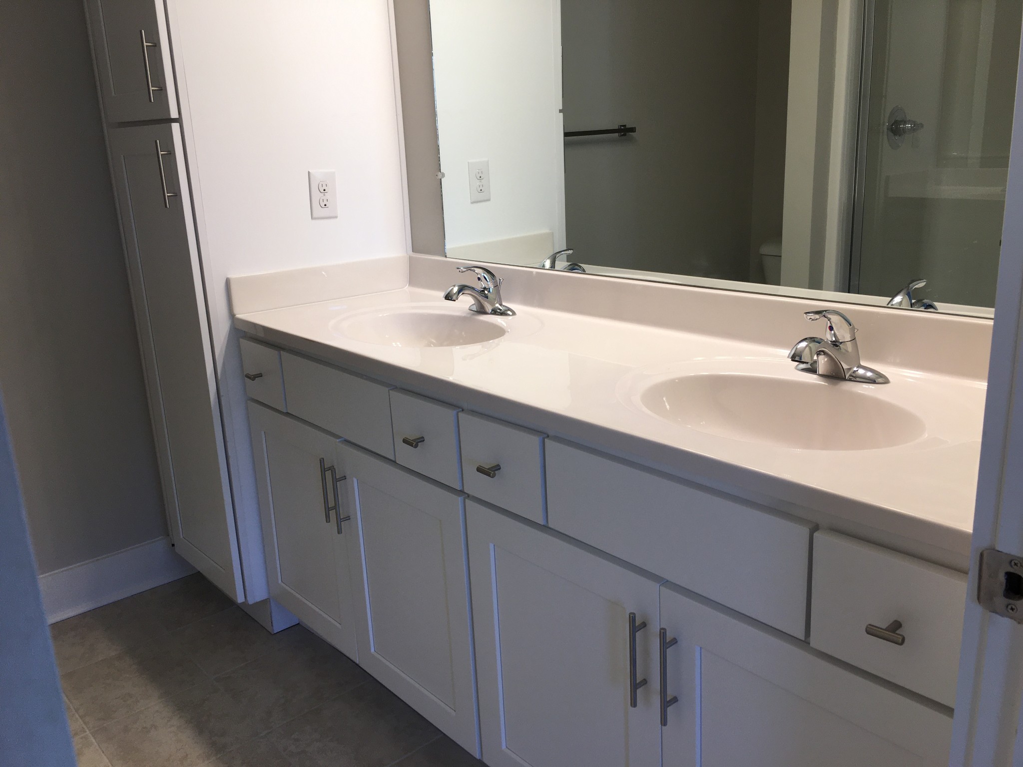 7006 Magnolia Crossings Spring Hill, TN 37174 - Photo 7 of 18 a bathroom with a sink and a mirror