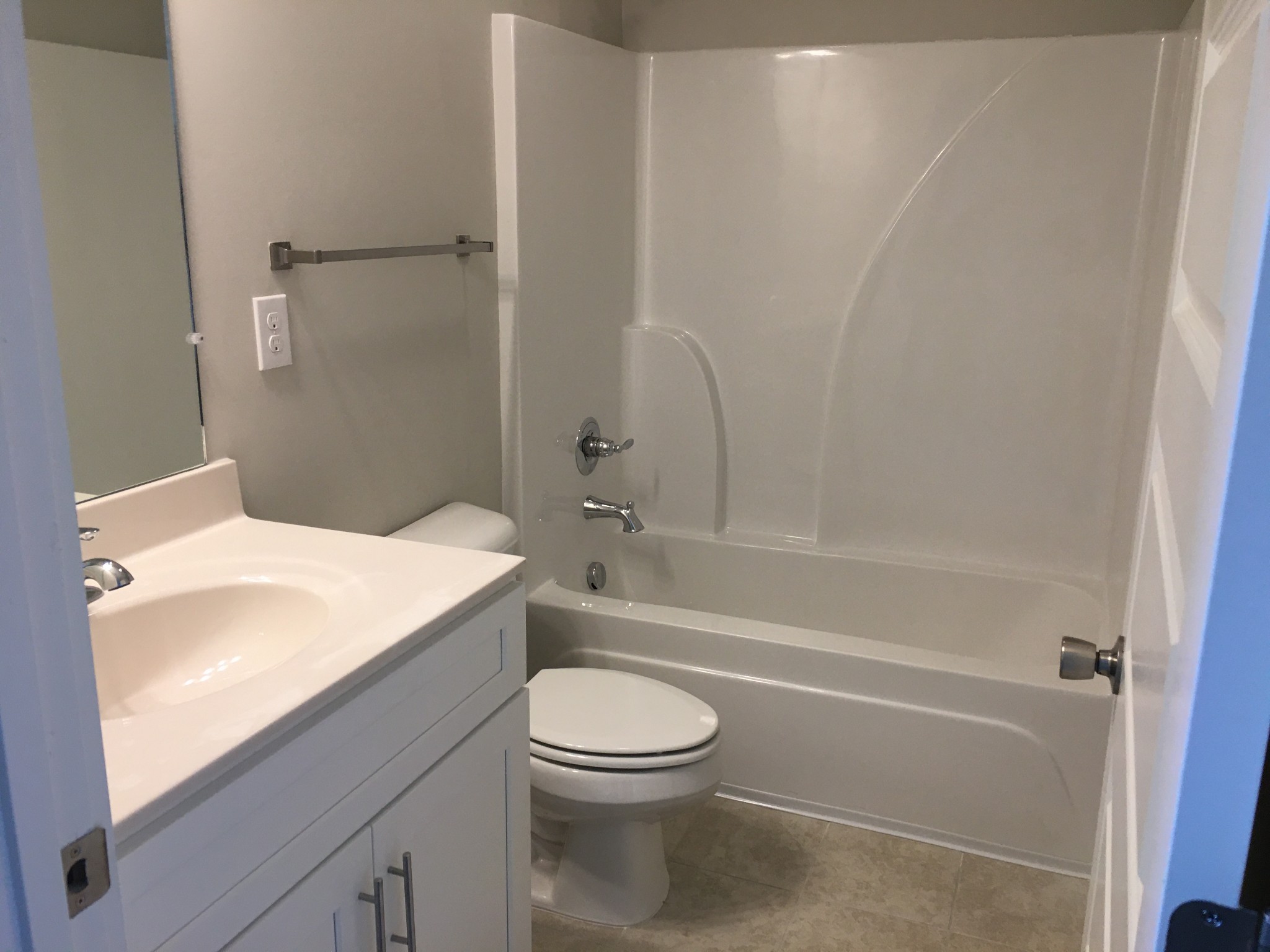 7006 Magnolia Crossings Spring Hill, TN 37174 - Photo 9 of 18 a bathroom with a toilet a sink and a bathtub