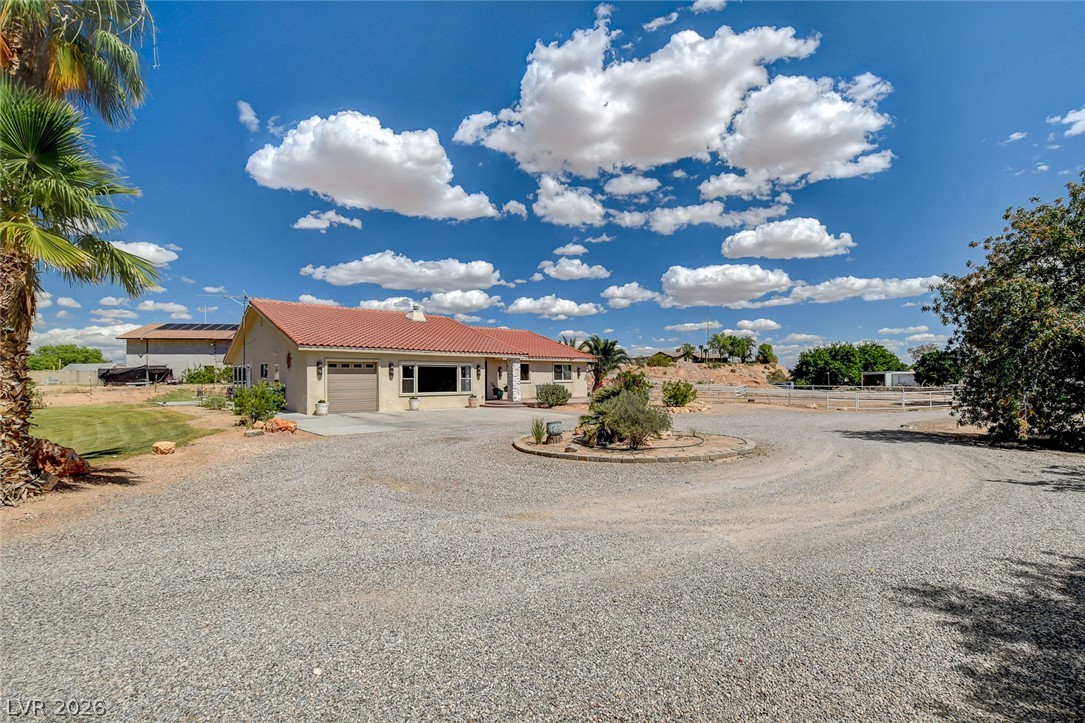 1950 Bowman Road Logandale, NV 89021 - Photo 49 of 81 A spacious gravel circular driveway welcomes you to this desert oasis home with mature landscaping.