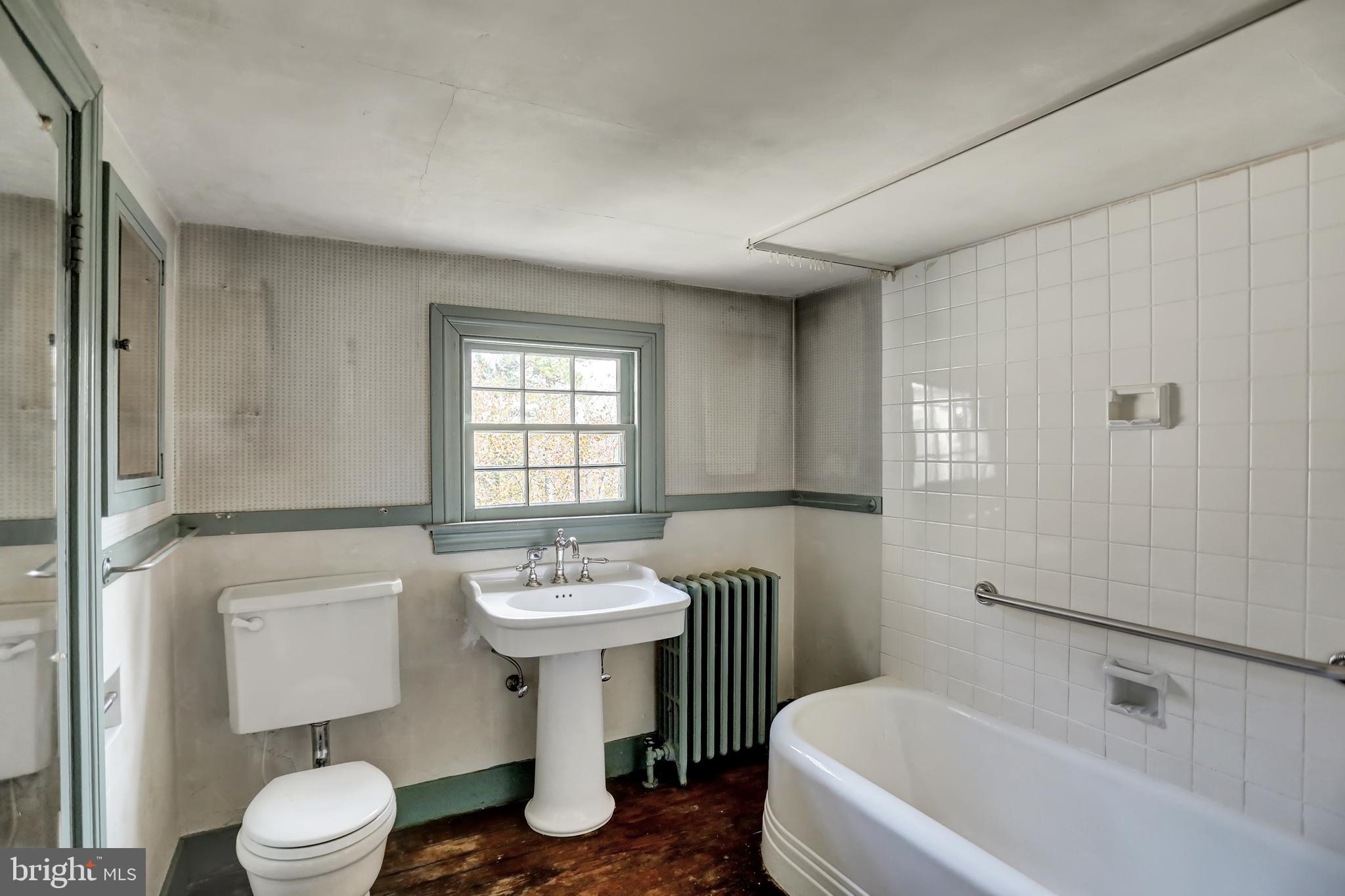 10909 Garrison Forest Road Owings Mills, MD 21117 - Photo 33 of 59 Back hall bath with shower and tub