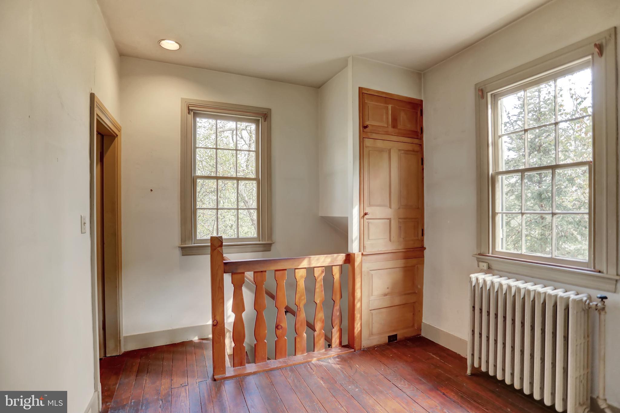 10909 Garrison Forest Road Owings Mills, MD 21117 - Photo 40 of 59 Back hall stair landing