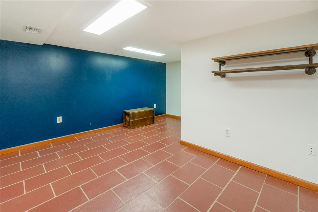 1325 Granger Road Northampton, PA 18067 - Photo 41 of 61 A versatile open-plan space with durable terracotta tile flooring awaits personalization.
