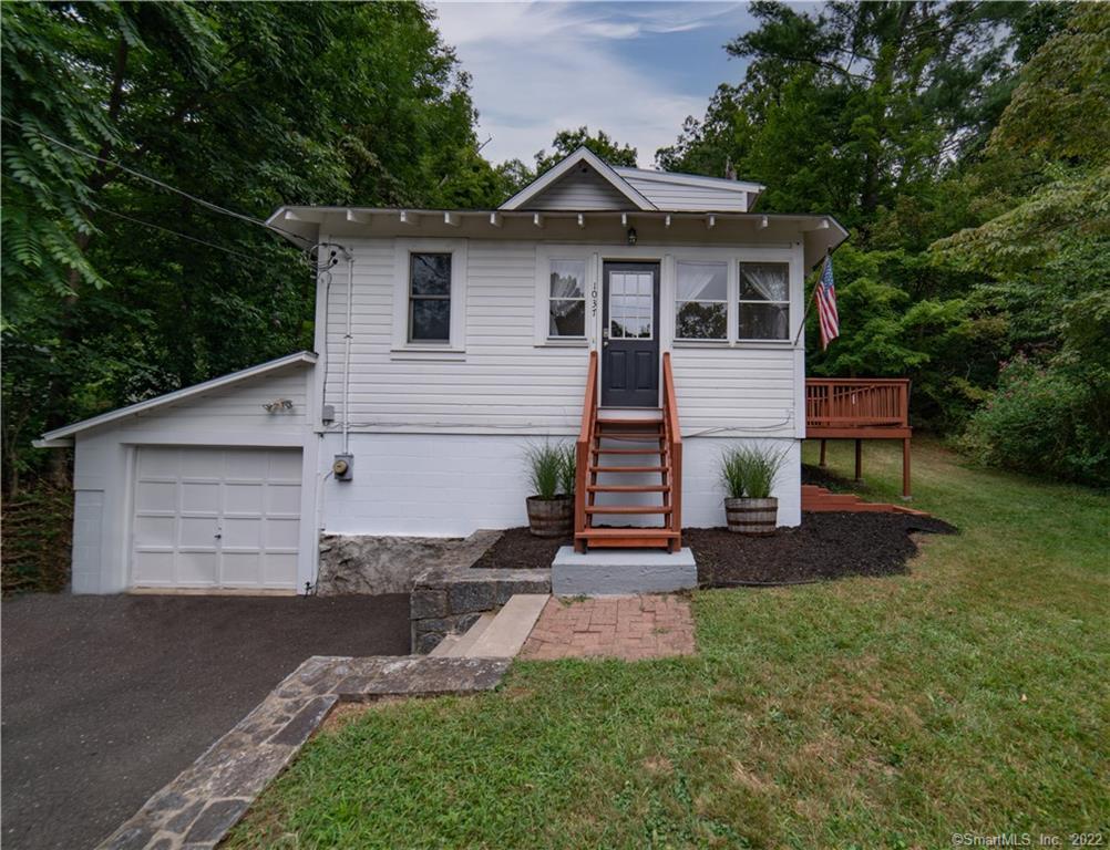 1037 Lakeside Road Southbury, CT 06488 - Photo 1 of 1 a front view of a house with a garden and yard