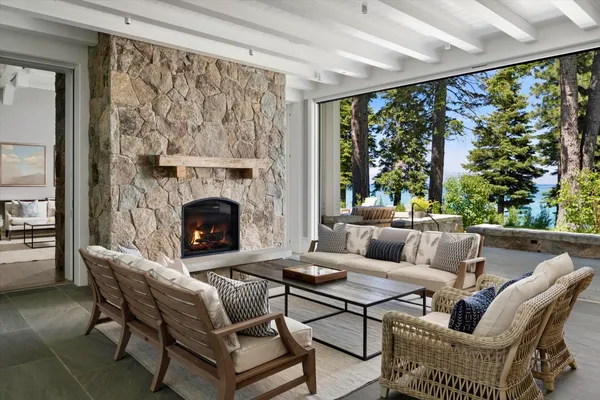 a living room with furniture and a fireplace