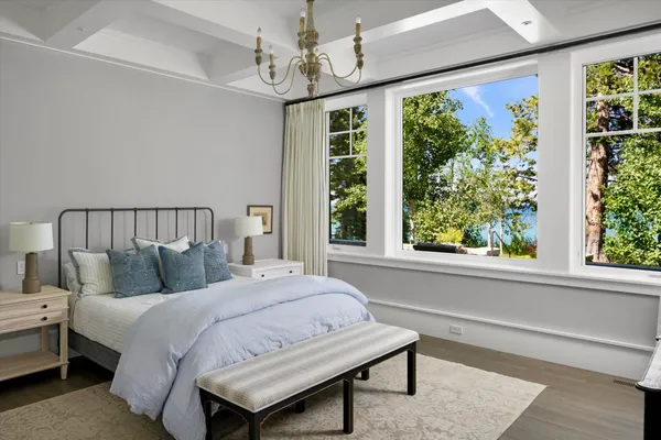 a bedroom with a large bed and a window