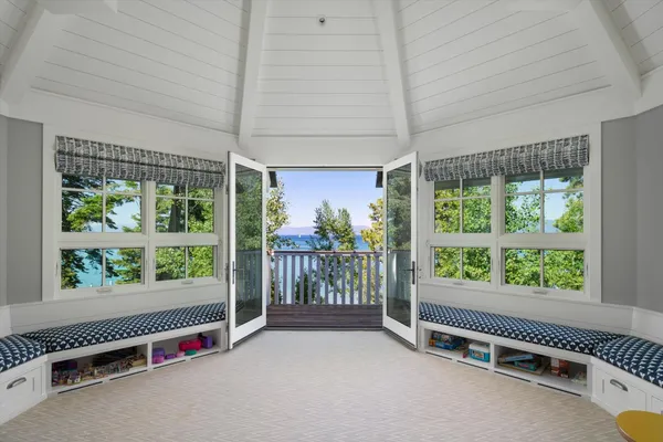 a view of a room with gym equipment and floor to ceiling window