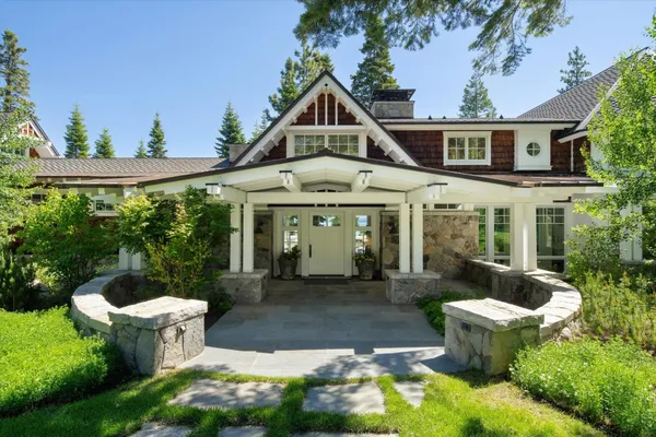 a front view of a house with garden