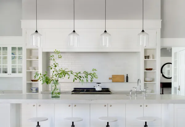 a kitchen with stainless steel appliances kitchen island granite countertop a sink a counter space and cabinets