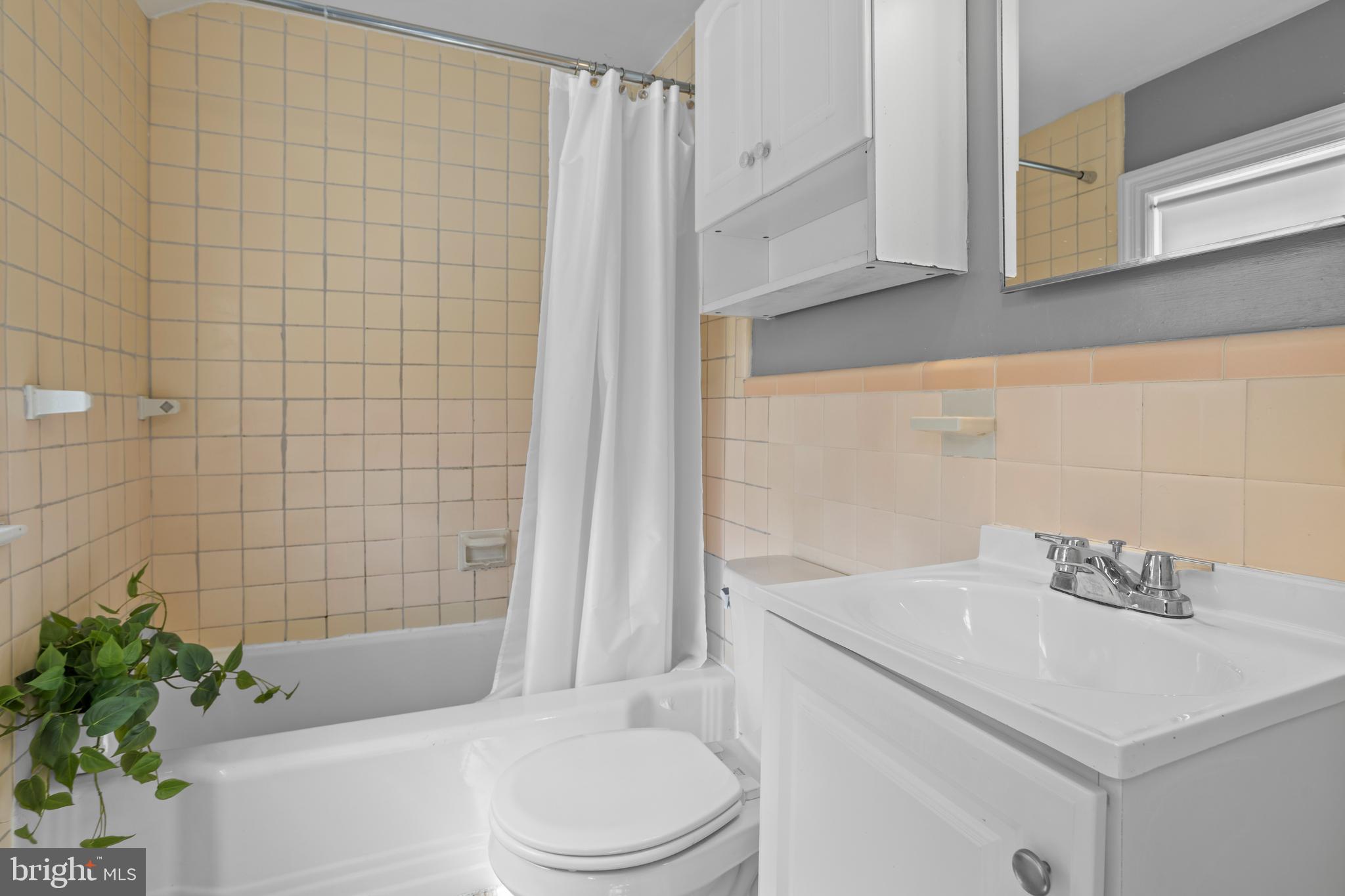 30 Wayne Avenue Springfield, PA 19064 - Photo 17 of 24 a bathroom with a sink a toilet and shower