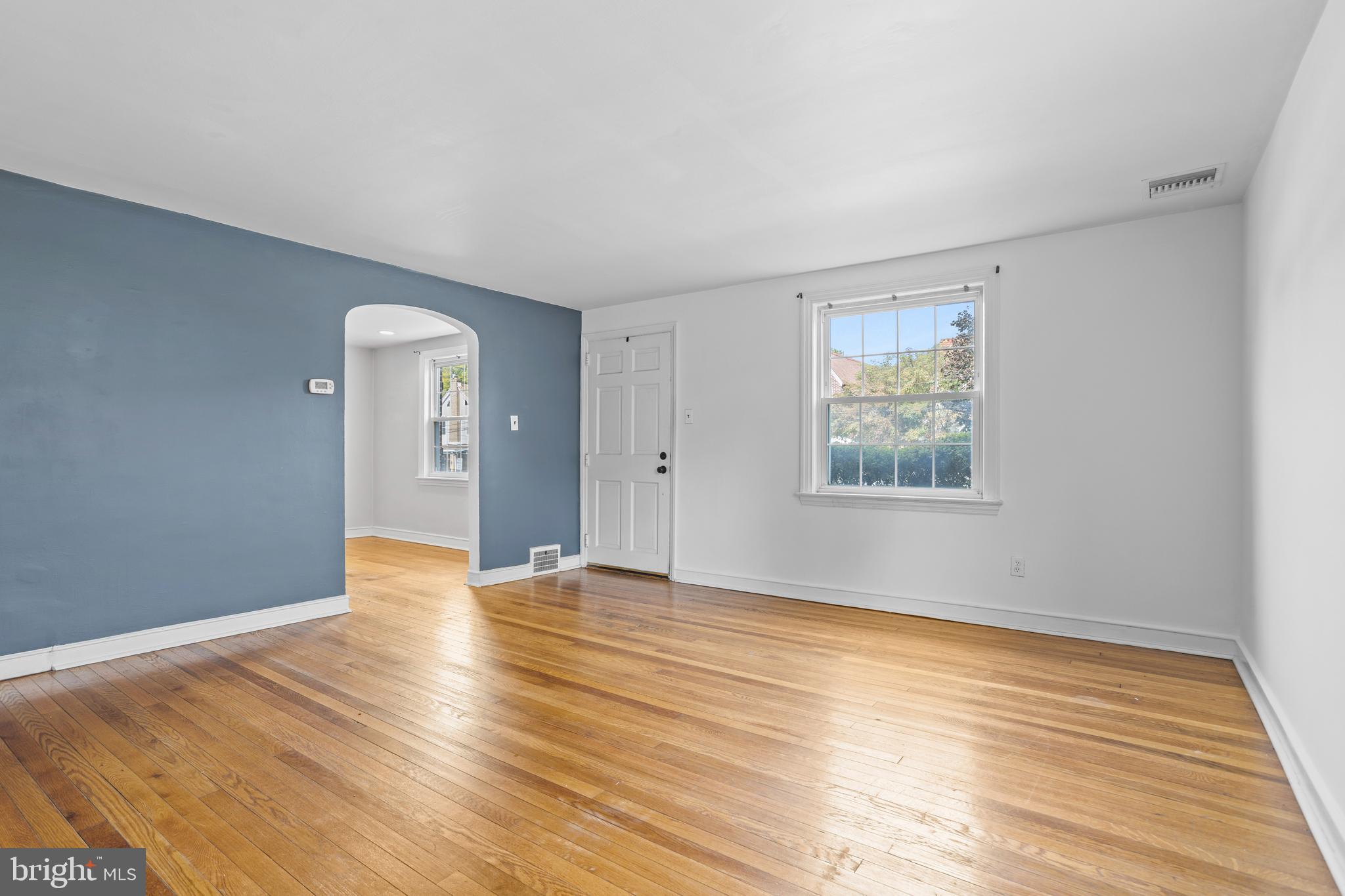 30 Wayne Avenue Springfield, PA 19064 - Photo 5 of 24 an empty room with wooden floor and windows
