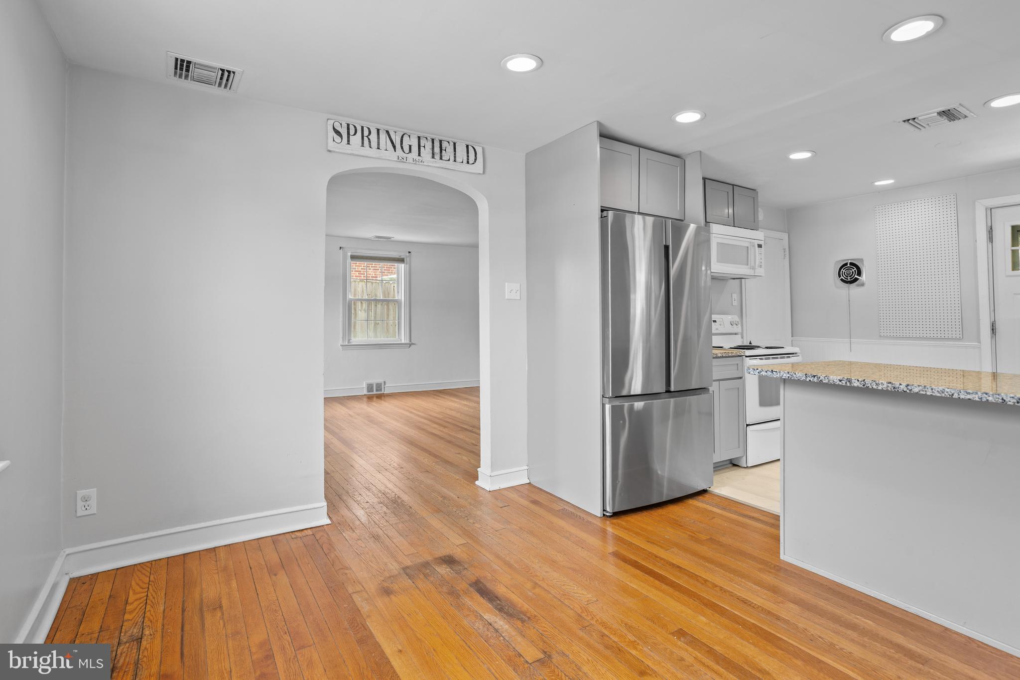 30 Wayne Avenue Springfield, PA 19064 - Photo 6 of 24 a kitchen with stainless steel appliances granite countertop a refrigerator and a sink