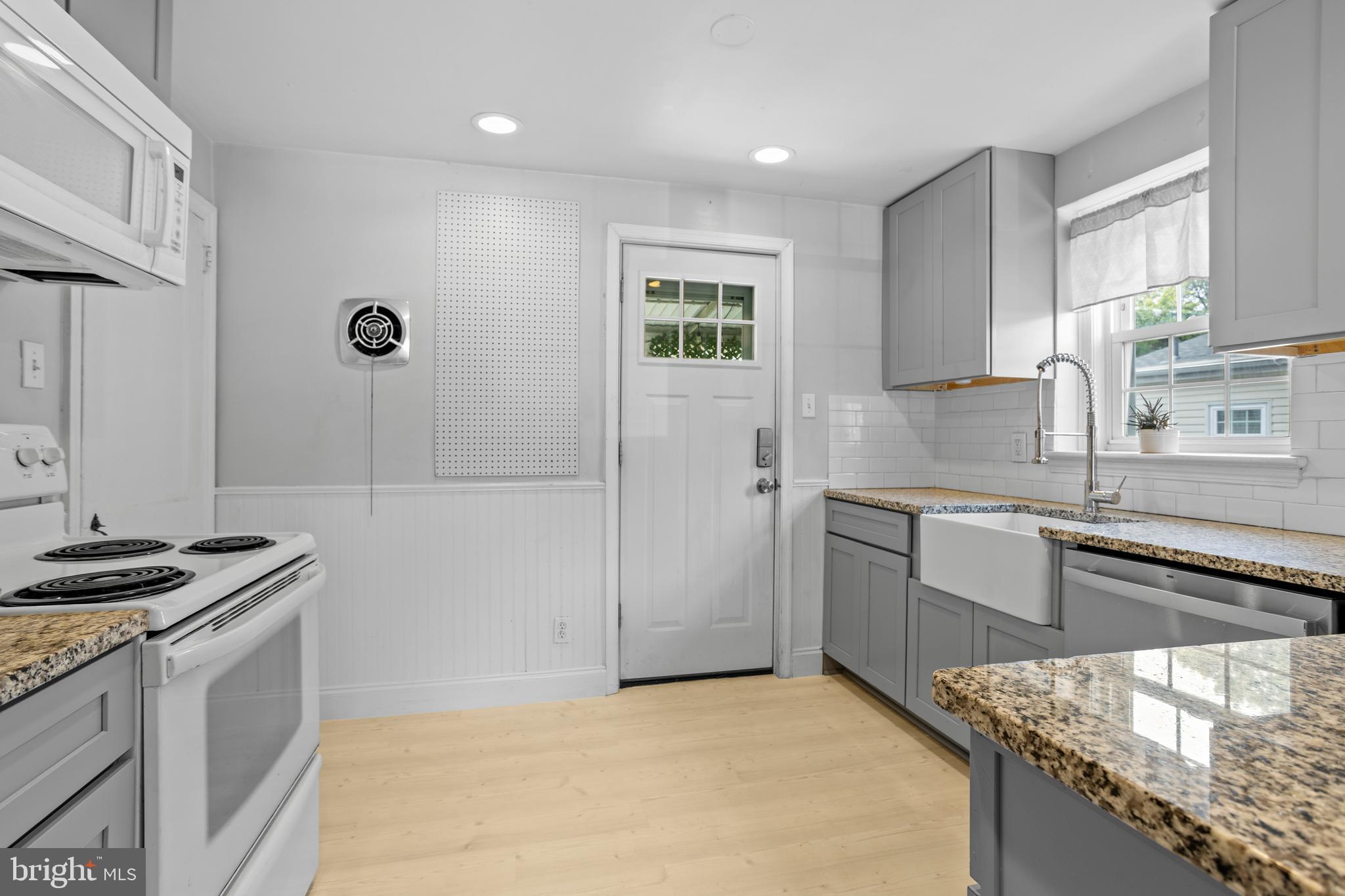 30 Wayne Avenue Springfield, PA 19064 - Photo 10 of 24 a kitchen with granite countertop a sink stainless steel appliances and cabinets