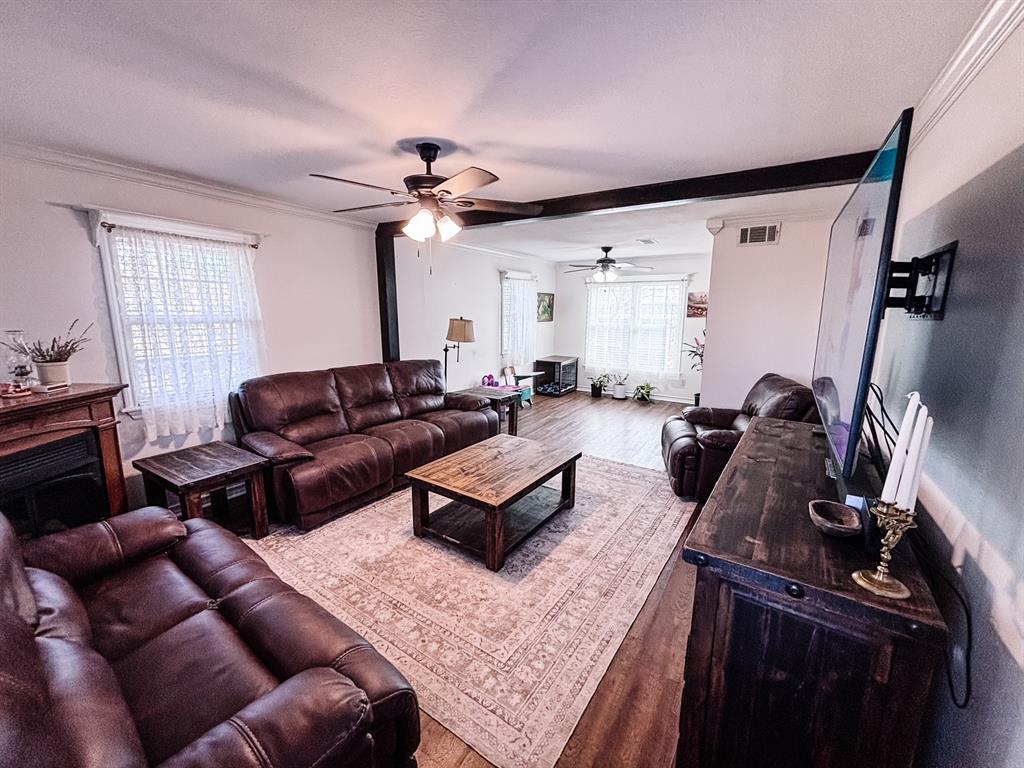 7634 Preston Road Denison, TX 75020 - Photo 11 of 34 a living room with furniture and a window