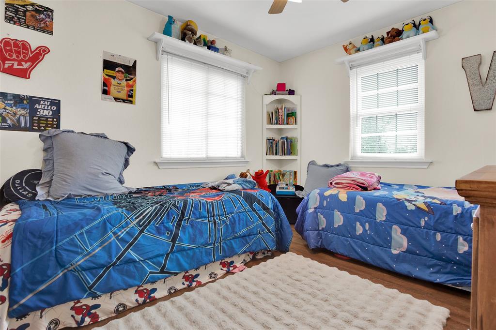 7634 Preston Road Denison, TX 75020 - Photo 16 of 34 a bedroom with bed and windows