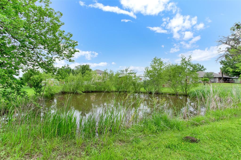7634 Preston Road Denison, TX 75020 - Photo 33 of 34 a view of a lake with a yard