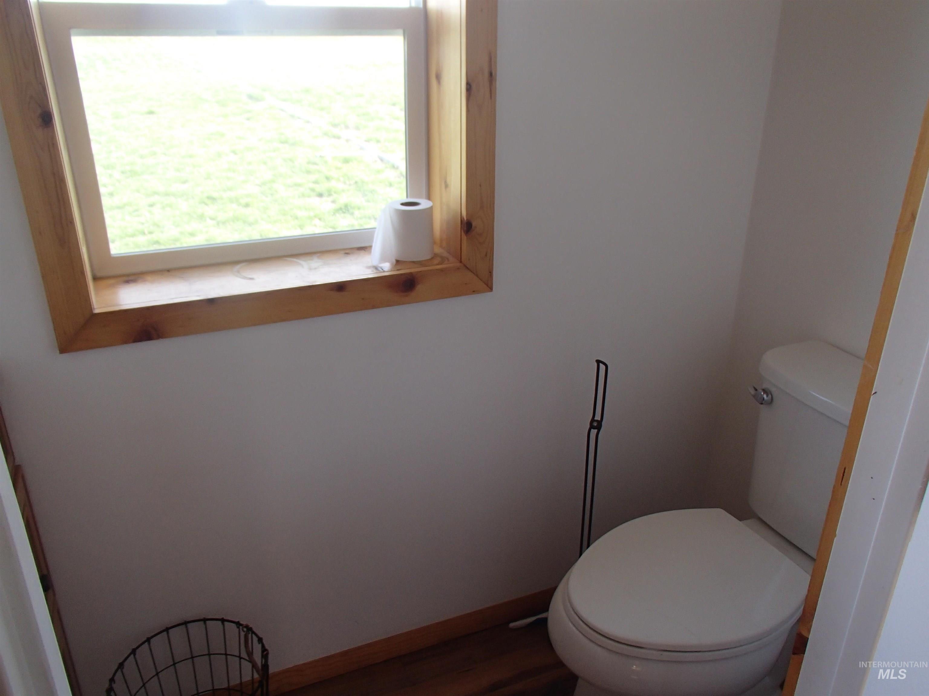 9506 Wright Road Melba, ID 83641 - Photo 20 of 37 Bathroom featuring baseboards and wood finished floors