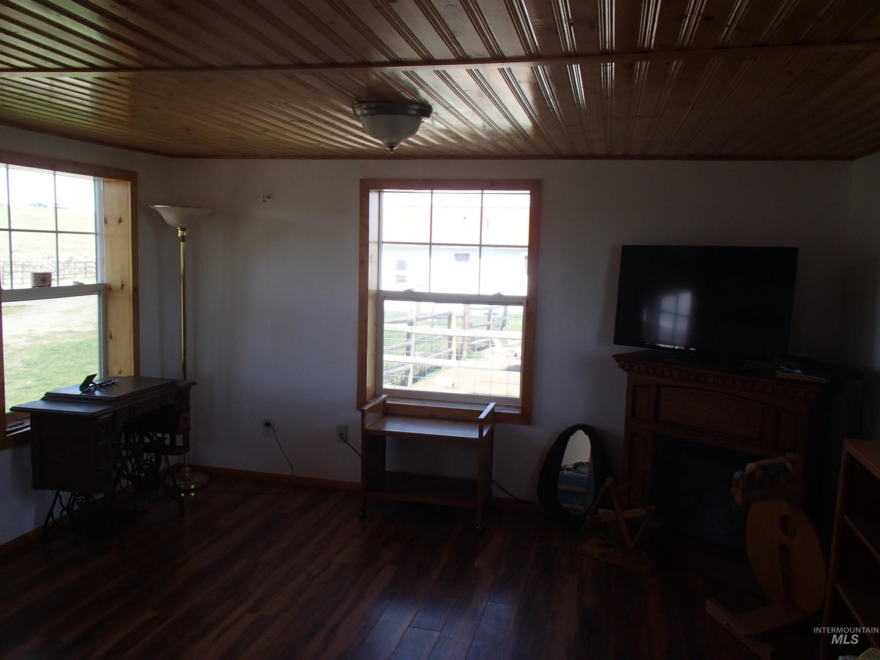 9506 Wright Road Melba, ID 83641 - Photo 21 of 37 Living room with dark wood-type flooring and wooden ceiling