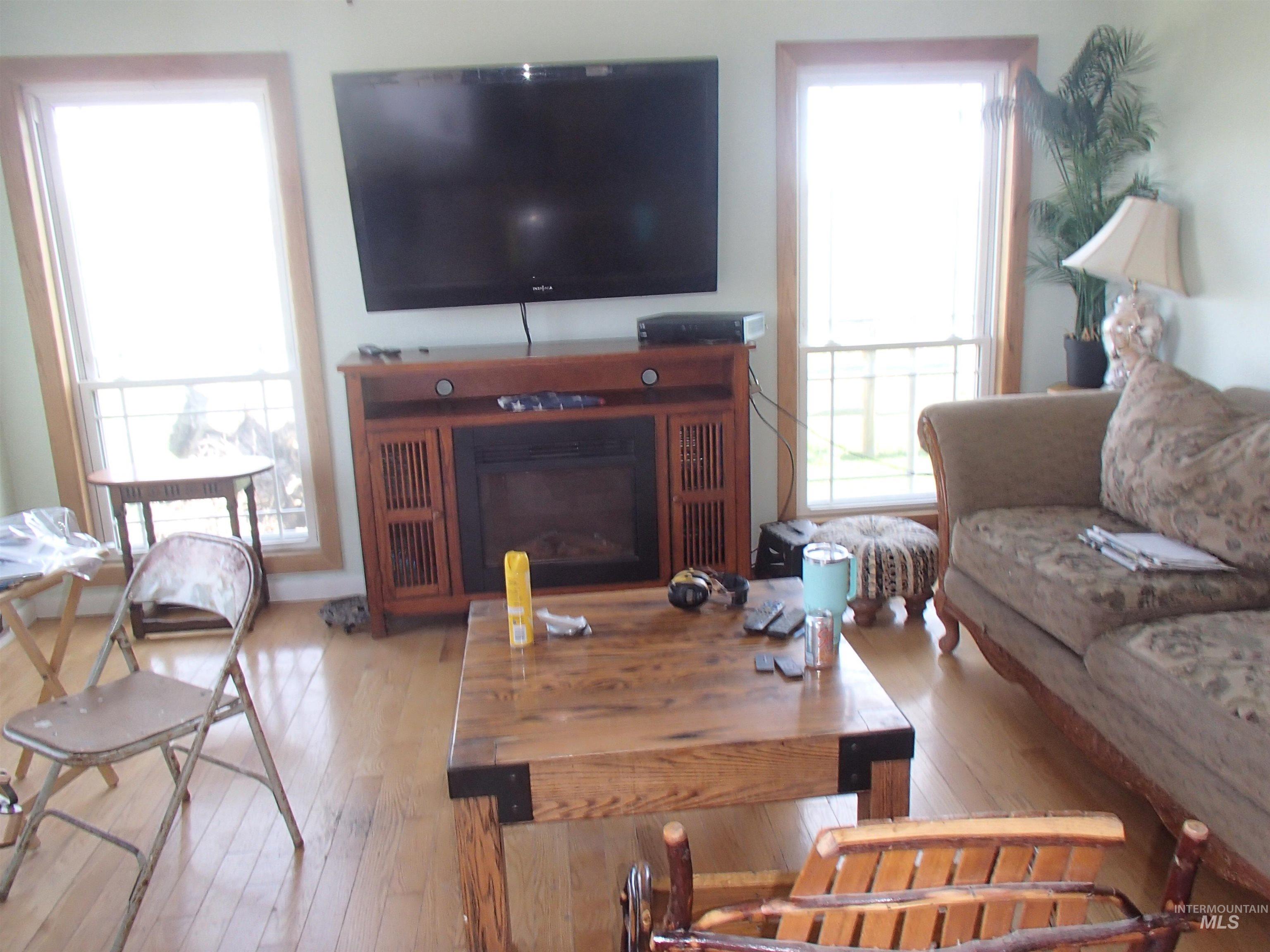 9506 Wright Road Melba, ID 83641 - Photo 3 of 37 Living room featuring light wood-type flooring and a fireplace