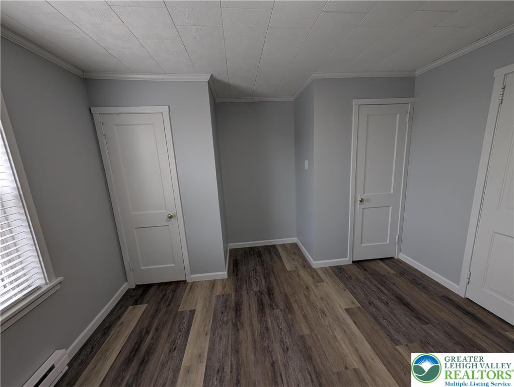 1111 Catasauqua Road, Unit 2 Whitehall, PA 18052 - Photo 5 of 9 a view of an empty room and wooden floor