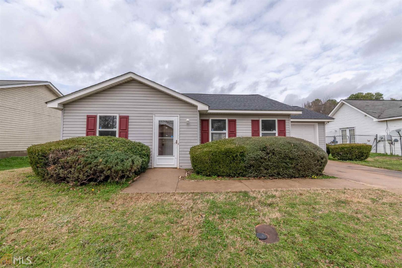 326 Hollow Ridge Drive Athens, GA 30607 - Photo 1 of 1 a view of house that has a small yard and large trees