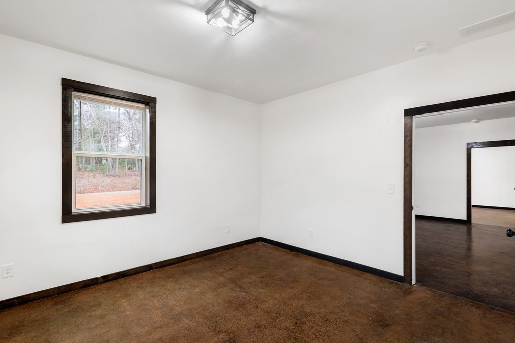 620 B Stiles Road Epworth, GA 30541 - Photo 12 of 20 an empty room with a window