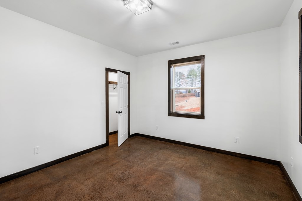 620 B Stiles Road Epworth, GA 30541 - Photo 13 of 20 an empty room with windows