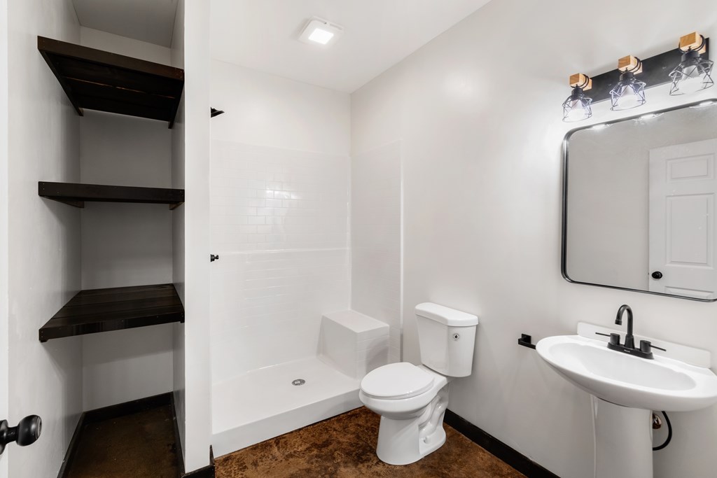 620 B Stiles Road Epworth, GA 30541 - Photo 16 of 20 a bathroom with a toilet a sink and a mirror