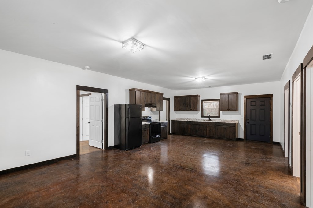 620 B Stiles Road Epworth, GA 30541 - Photo 2 of 20 a view of a living room a refrigerator and a stove