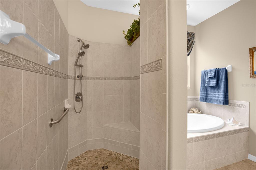 16411 Southwest 14th Avenue Road Ocala, FL 34473 - Photo 18 of 59 a bathroom with a granite countertop shower sink and mirror