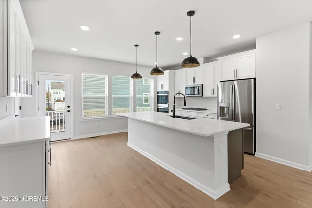 a bathroom with a shower and a sink