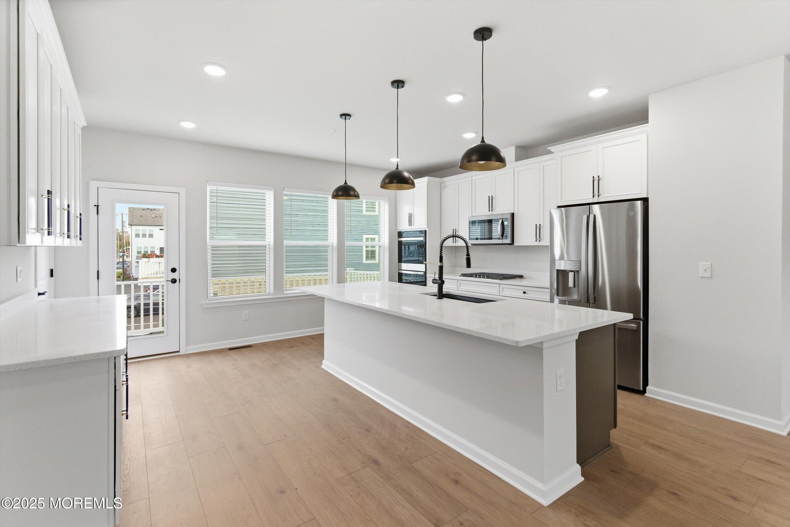 4 Barton Avenue Oceanport, NJ 07757 - Photo 11 of 47 a kitchen with stainless steel appliances a sink stove and refrigerator