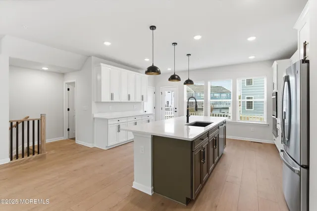 a bathroom with a sink vanity and a mirror