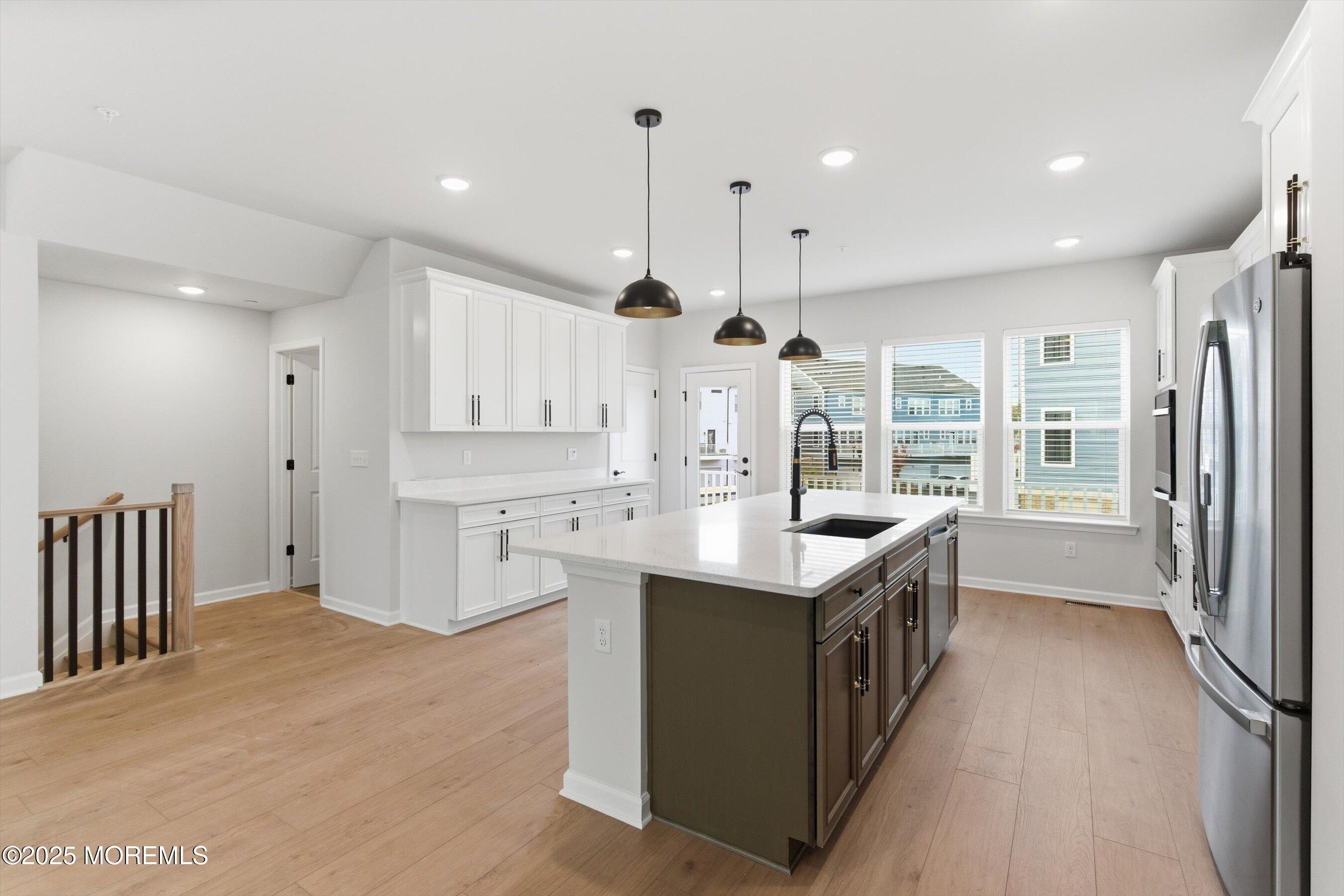 4 Barton Avenue Oceanport, NJ 07757 - Photo 12 of 47 a kitchen with stainless steel appliances granite countertop a sink stove and refrigerator