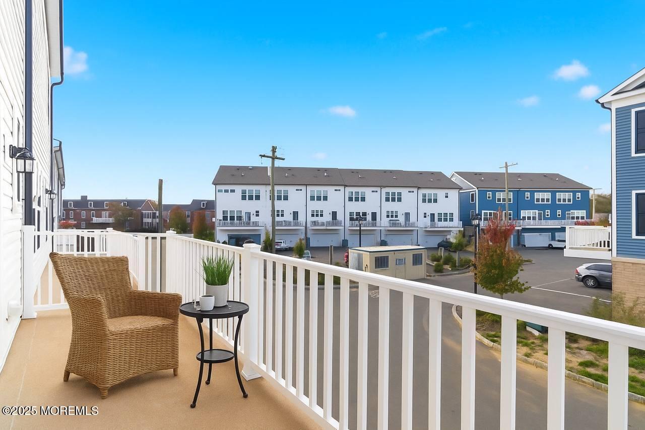 4 Barton Avenue Oceanport, NJ 07757 - Photo 14 of 47 a view of a balcony with two chairs and a table