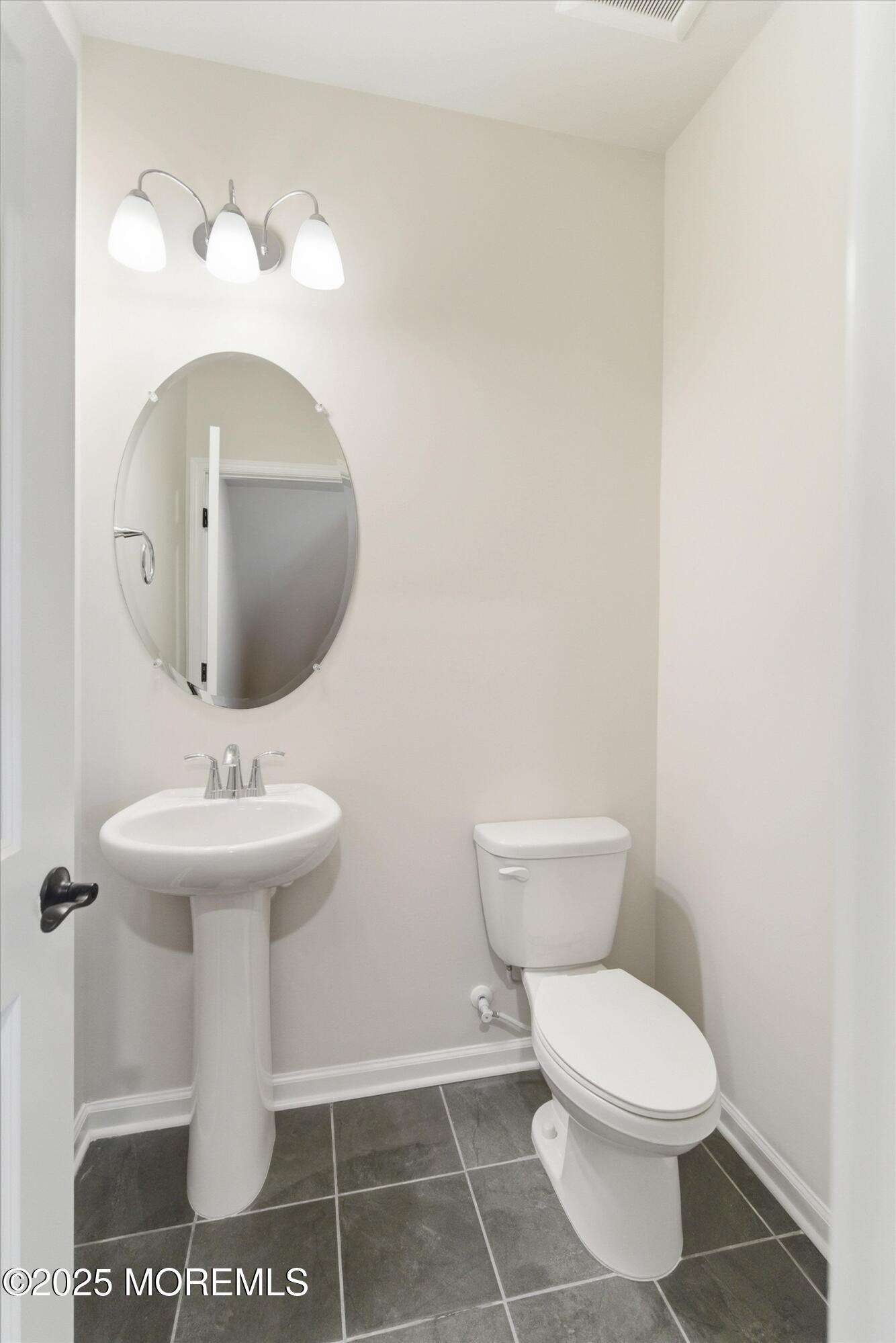 4 Barton Avenue Oceanport, NJ 07757 - Photo 20 of 47 a bathroom with a sink a toilet and mirror