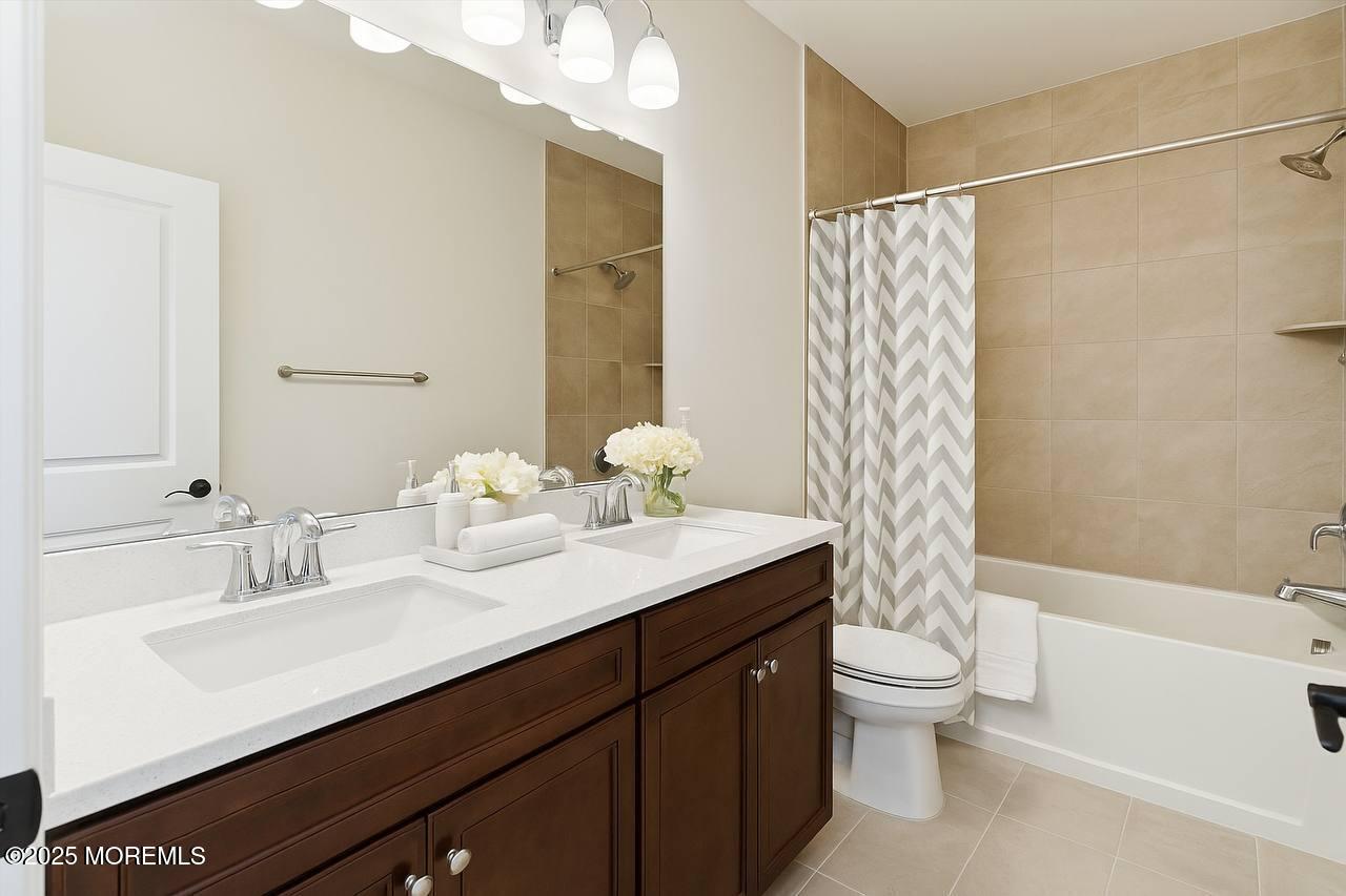 4 Barton Avenue Oceanport, NJ 07757 - Photo 26 of 47 a bathroom with a sink toilet double vanity and shower