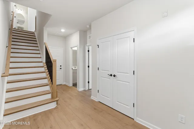 a view of a balcony with two chairs and a table