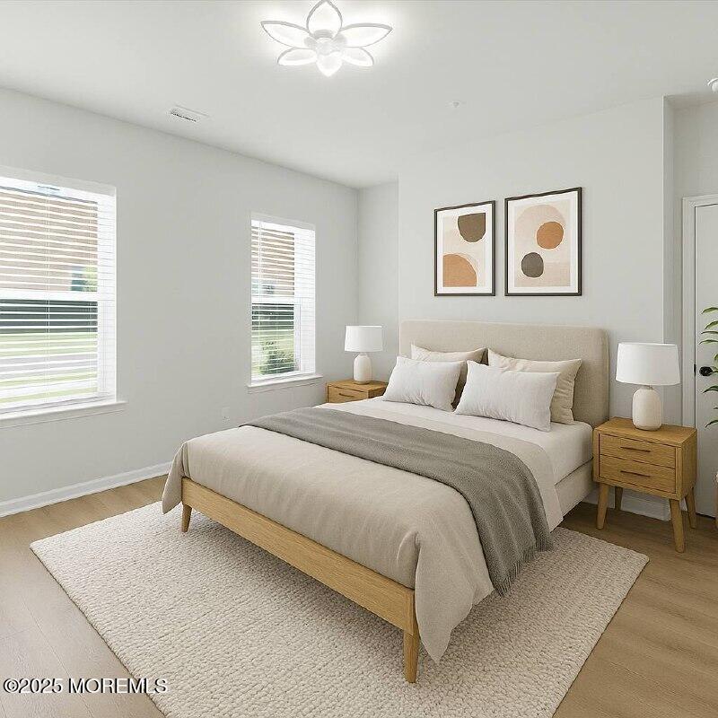 4 Barton Avenue Oceanport, NJ 07757 - Photo 8 of 47 a bedroom with a bed and a window