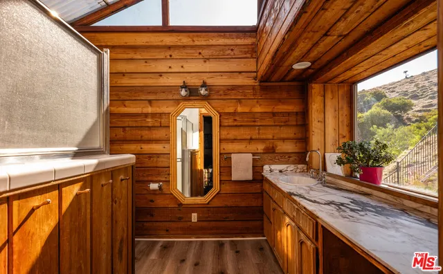 a kitchen with a sink and a window