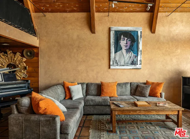 a blue couch sitting in front of a door