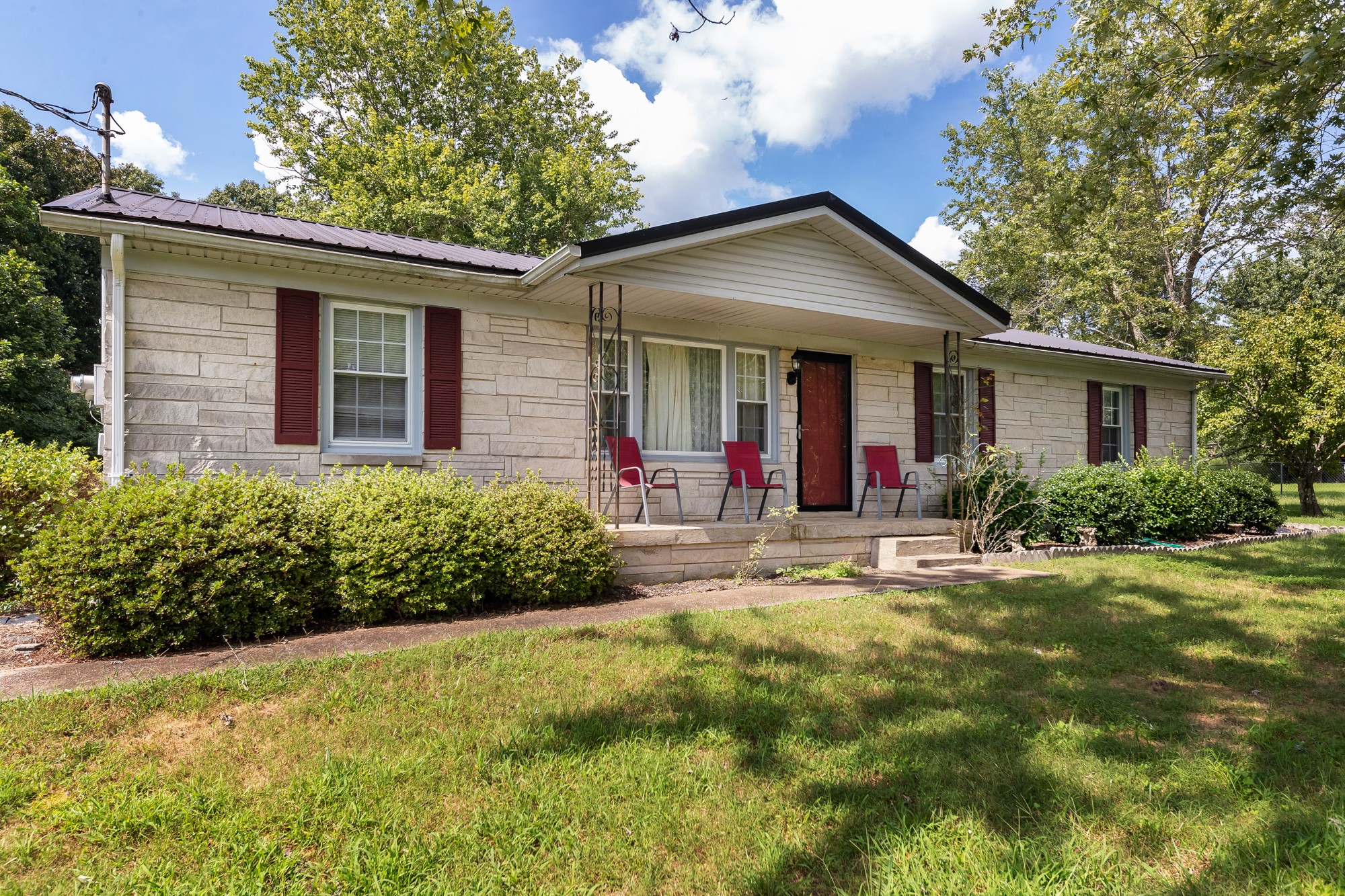 1274 Fall River Road Goodspring, TN 38460 - Photo 1 of 24 a front view of house with yard and green space
