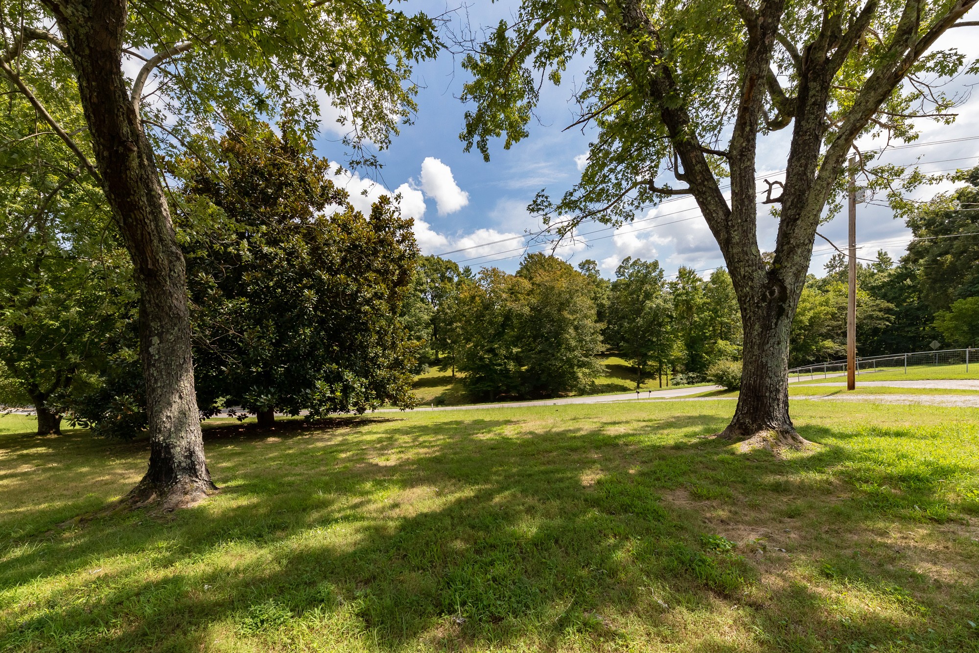 1274 Fall River Road Goodspring, TN 38460 - Photo 2 of 24 a backyard of a house with lots of green space