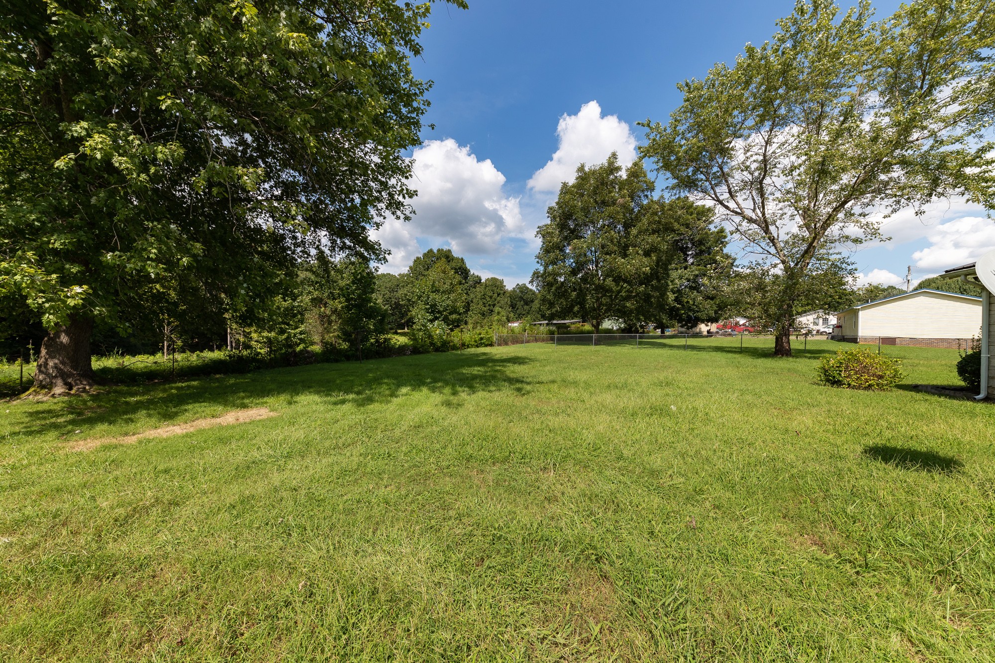 1274 Fall River Road Goodspring, TN 38460 - Photo 22 of 24 a view of outdoor space with deck and yard