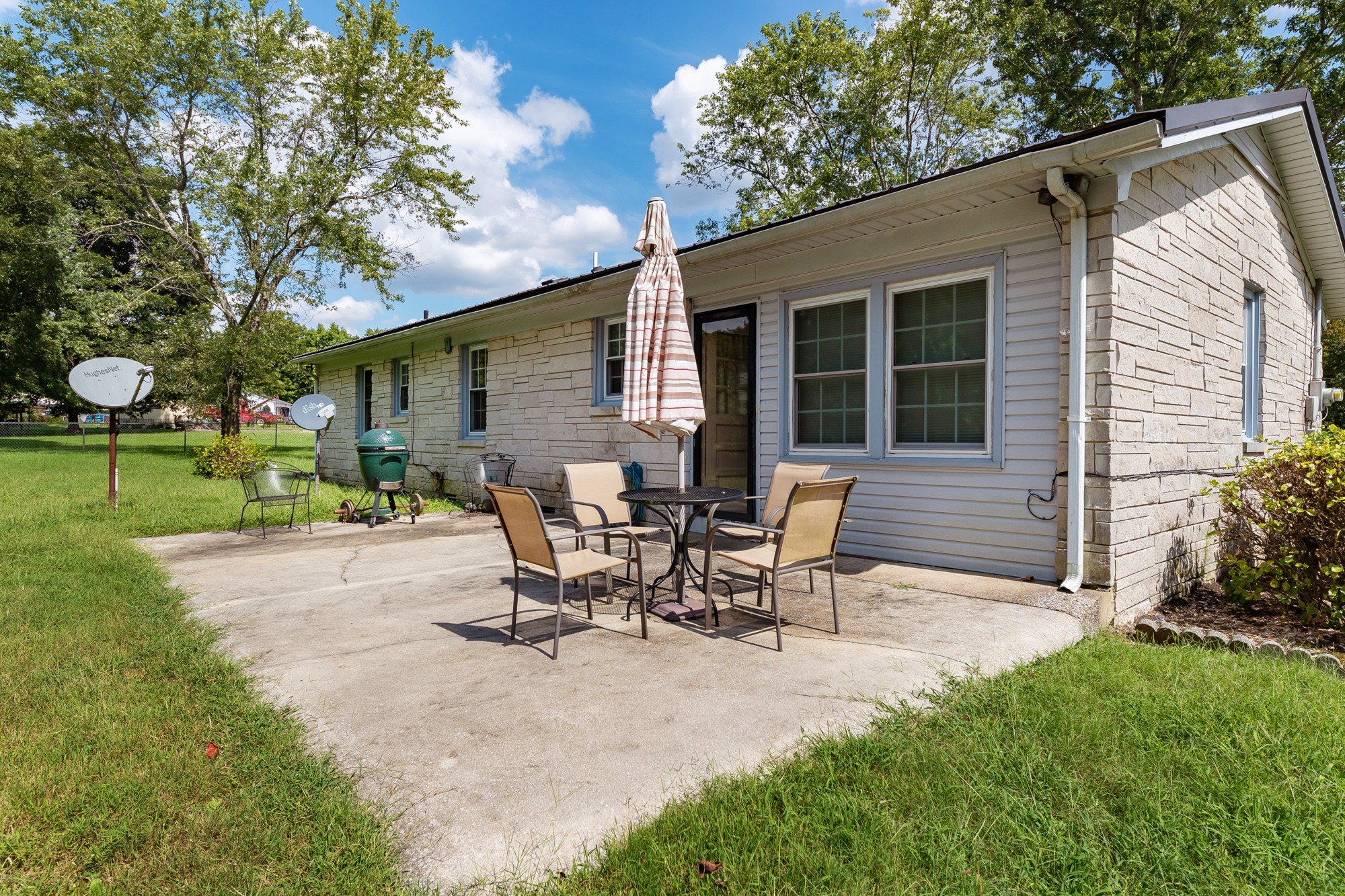 1274 Fall River Road Goodspring, TN 38460 - Photo 5 of 24 a view of a house with patio and a yard