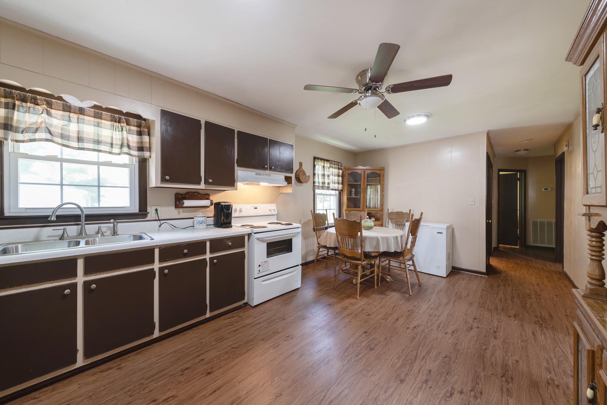 1274 Fall River Road Goodspring, TN 38460 - Photo 6 of 24 a open kitchen with stainless steel appliances granite countertop a stove and a wooden floors