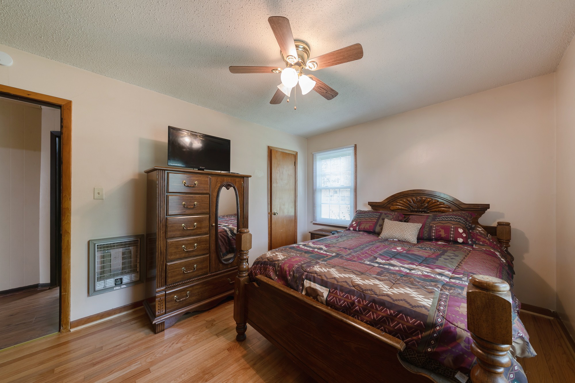 1274 Fall River Road Goodspring, TN 38460 - Photo 10 of 24 a bedroom with a bed and wooden floor