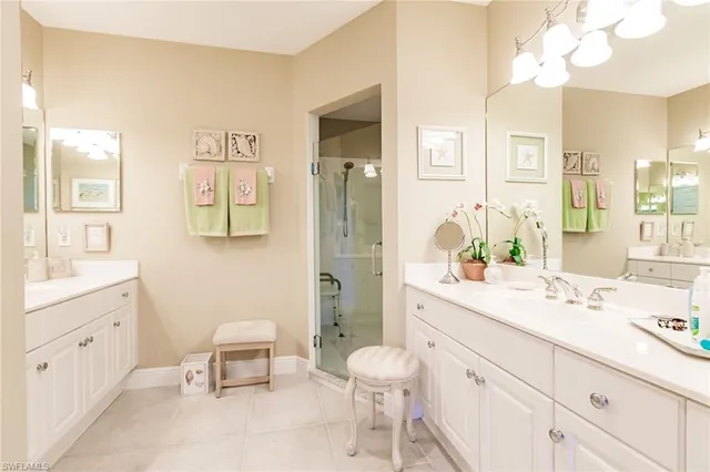 a spacious bathroom with a sink mirror and a toilet