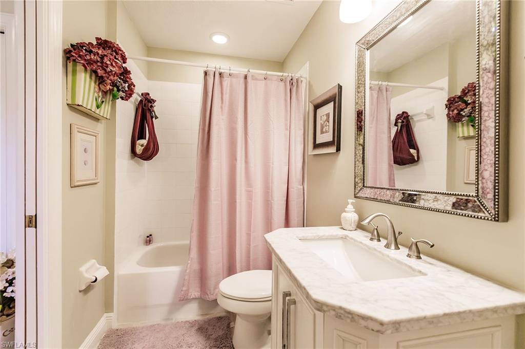 3910 Deer Crossing Court, Unit 1 Naples, FL 34114 - Photo 30 of 38 a bathroom with a sink toilet and shower