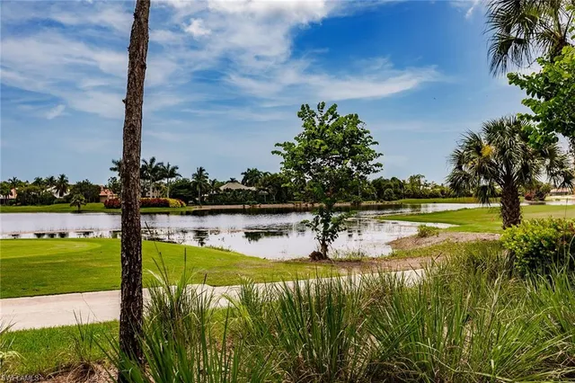 a view of a lake with a big yard