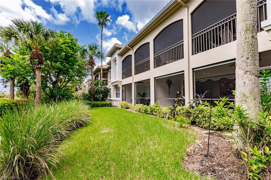 3910 Deer Crossing Court, Unit 1 Naples, FL 34114 - Photo 36 of 38 a view of an house with backyard and garden